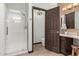 Well-lit bathroom featuring a walk-in shower, vanity, and a neutral color palette at 1737 E Marquette Dr, Gilbert, AZ 85234