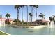 Scenic view of Val Vista Lakes sign with palm trees and community businesses in the background at 1737 E Marquette Dr, Gilbert, AZ 85234