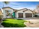 Charming single-story home with a well-manicured lawn, inviting curb appeal, and a two-car garage at 1737 E Marquette Dr, Gilbert, AZ 85234