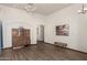 Spacious living room with wood floors, an archway, and classic decor at 1737 E Marquette Dr, Gilbert, AZ 85234