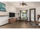 Cozy living room with vaulted ceilings, ample natural light, and stylish wood-look tile flooring at 1737 E Marquette Dr, Gilbert, AZ 85234