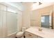 Bright bathroom with a shower-tub, white tile, and a vanity sink at 1777 E Dubois Ave, Gilbert, AZ 85298