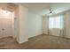 Spacious bedroom with carpet, ceiling fan, and curtains that let in natural light at 1777 E Dubois Ave, Gilbert, AZ 85298