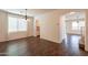 Bright dining area featuring wood floors, an elegant chandelier, and ample natural light at 1777 E Dubois Ave, Gilbert, AZ 85298