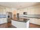 Bright kitchen with stainless steel appliances, marble backsplash, granite countertops and sleek island at 1777 E Dubois Ave, Gilbert, AZ 85298