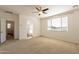 Spacious main bedroom featuring carpet, ceiling fan, and a window offering natural light at 1777 E Dubois Ave, Gilbert, AZ 85298