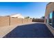 Large, low-maintenance backyard with brick walls surrounding the property at 19202 W Jackson St, Buckeye, AZ 85326