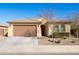 Charming single story home with a two car garage and low maintenance landscaping at 19202 W Jackson St, Buckeye, AZ 85326