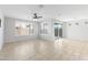 Bright living room featuring large windows and sliding glass doors to the backyard at 19202 W Jackson St, Buckeye, AZ 85326