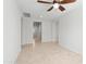 Open-concept living room with tile floors, ceiling fan, and recessed lighting at 19202 W Jackson St, Buckeye, AZ 85326