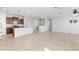 Open-concept living space with tile floors and a kitchen island at 19202 W Jackson St, Buckeye, AZ 85326