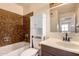 Bathroom features a shower and tub combination and vanity at 1925 W Wood Dr, Phoenix, AZ 85029