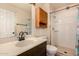 Updated bathroom featuring a shower, a modern vanity, and plenty of storage at 1925 W Wood Dr, Phoenix, AZ 85029