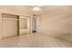 Bedroom includes a large mirrored closet and tiled floor at 1925 W Wood Dr, Phoenix, AZ 85029