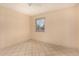 Bright bedroom featuring tile flooring and a window with natural light at 1925 W Wood Dr, Phoenix, AZ 85029