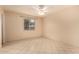 Bright bedroom with tiled floor, ceiling fan, and natural lighting at 1925 W Wood Dr, Phoenix, AZ 85029