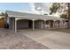 Charming single-story home featuring a carport, covered front porch and mature landscaping at 1925 W Wood Dr, Phoenix, AZ 85029