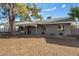 Charming single-story home featuring a carport, covered front porch and mature landscaping at 1925 W Wood Dr, Phoenix, AZ 85029