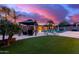 Outdoor oasis featuring a gazebo, pool, lounge chairs, and synthetic grass, perfect for entertaining and relaxing at 19349 W Oregon Ave, Litchfield Park, AZ 85340