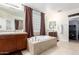 Bathroom with a soaking tub, double sink vanity, natural light and modern fixtures at 19349 W Oregon Ave, Litchfield Park, AZ 85340