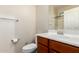 Cozy bathroom featuring a modern sink, vanity, and a toilet at 19349 W Oregon Ave, Litchfield Park, AZ 85340