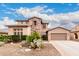 Beautiful home with well-maintained landscaping and a two-car attached garage at 19349 W Oregon Ave, Litchfield Park, AZ 85340