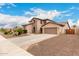 Attractive home with a well-manicured lawn, two-car garage, and welcoming entrance at 19349 W Oregon Ave, Litchfield Park, AZ 85340