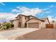 Charming home with two-car garage, stone accents and drought-tolerant landscaping at 19349 W Oregon Ave, Litchfield Park, AZ 85340