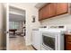 Well-equipped laundry room featuring modern appliances and ample storage space at 19349 W Oregon Ave, Litchfield Park, AZ 85340