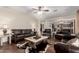 Cozy living room with leather furniture and an open floor plan at 19349 W Oregon Ave, Litchfield Park, AZ 85340