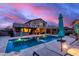 Stunning pool with lounge chairs and umbrellas, perfect for relaxation in this beautiful outdoor space at 19349 W Oregon Ave, Litchfield Park, AZ 85340