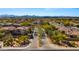 An aerial view of a quiet residential community, lined with sidewalks and desert landscaping at 19550 N Grayhawk Dr # 2038, Scottsdale, AZ 85255