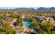 An aerial shot of a resort-style community with a large pool, spa, and beautifully landscaped areas at 19550 N Grayhawk Dr # 2038, Scottsdale, AZ 85255