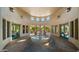 A view of the amenity center's interior, with a decorative fountain and access to the outdoor patio at 19550 N Grayhawk Dr # 2038, Scottsdale, AZ 85255