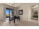 Dining room with neutral tones, modern lighting, and access to the balcony at 19550 N Grayhawk Dr # 2038, Scottsdale, AZ 85255