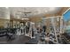 Bright gym showcasing an array of modern weightlifting equipment and mounted television at 19550 N Grayhawk Dr # 2038, Scottsdale, AZ 85255