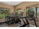 Well-equipped gym featuring treadmills and large windows offering views of the lush outdoor scenery at 19550 N Grayhawk Dr # 2038, Scottsdale, AZ 85255