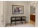 Hallway with carpet flooring, decor, and views into a bathroom at 19550 N Grayhawk Dr # 2038, Scottsdale, AZ 85255