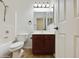 Well-lit bathroom featuring a shower-tub combo and a dark wood vanity with white countertop at 19603 N Toya St, Maricopa, AZ 85138