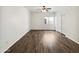 Neutral bedroom with wood-look floors, a ceiling fan and a sliding door closet at 19603 N Toya St, Maricopa, AZ 85138