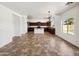 Open concept kitchen with dark cabinets, granite countertops, and a center island at 19603 N Toya St, Maricopa, AZ 85138