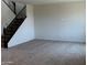 A blank canvas; empty living room with neutral carpeting ready for your personal touch at 19889 W Annika Dr, Litchfield Park, AZ 85340