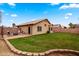 Large backyard with a brick-paved patio, lush lawn, and privacy fencing, great for outdoor enjoyment at 1993 S Spartan St, Gilbert, AZ 85233