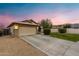 Single-story home with desert landscaping, two-car garage, and tile roof at 1993 S Spartan St, Gilbert, AZ 85233