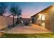 Outdoor patio area with brick pavers, seating, and string lights, perfect for entertaining at 1993 S Spartan St, Gilbert, AZ 85233