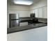 Modern kitchen with stainless steel appliances and breakfast bar at 20100 N 78Th Pl # 1007, Scottsdale, AZ 85255