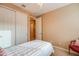 Bedroom features double door closet, neutral walls, and carpeted floors at 20742 E Mockingbird Dr, Queen Creek, AZ 85142