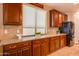 Granite countertops with custom cabinets and appliances make this a chef's dream kitchen at 20742 E Mockingbird Dr, Queen Creek, AZ 85142