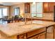 Double sink and granite countertops highlight this beautiful kitchen island at 20742 E Mockingbird Dr, Queen Creek, AZ 85142