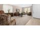 Inviting living room with neutral carpet, ample natural light, and comfortable seating at 20742 E Mockingbird Dr, Queen Creek, AZ 85142
